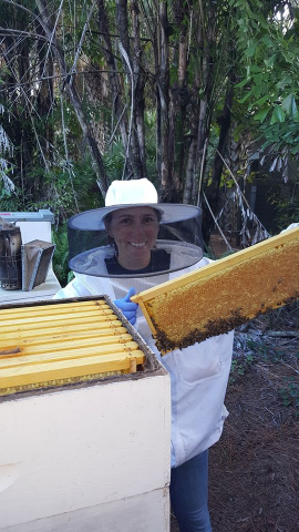 Zoo keepers become Bee keepers after training with BBBK.  After all we are in this together!  P.S. that is an AWESOME frame of capped honey!
